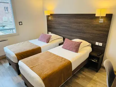 Un ou plusieurs lits dans un hébergement de l'établissement Hotel de la Cathedrale