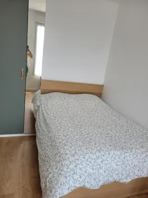 Un ou plusieurs lits dans un hébergement de l'établissement Appartement cosy