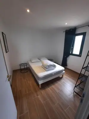 Un ou plusieurs lits dans un hébergement de l'établissement Appartement à la campagne