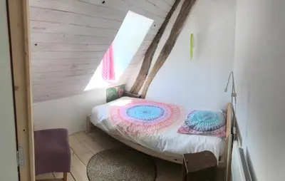 Un ou plusieurs lits dans un hébergement de l'établissement Appart dans longère Normande au coeur de la Forêt de Lyons