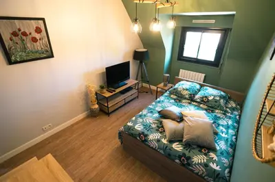 Un ou plusieurs lits dans un hébergement de l'établissement Green cosy