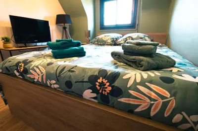 Un ou plusieurs lits dans un hébergement de l'établissement Green cosy