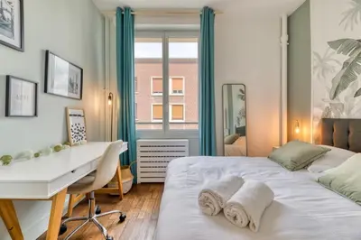 Un ou plusieurs lits dans un hébergement de l'établissement Cosy Jungle Un magnifique F5