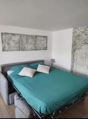 Un ou plusieurs lits dans un hébergement de l'établissement Maison Studio 4 personnes avec mezzanine