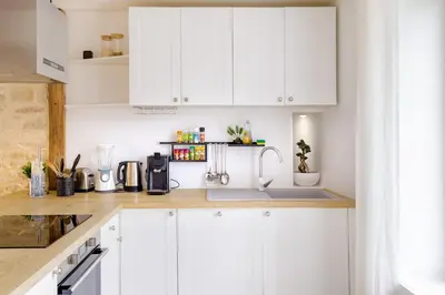 Cuisine ou kitchenette dans l'établissement Escapade au Cocon des Plaisirs Secrets Spa &Sauna