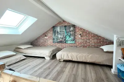 Un ou plusieurs lits dans un hébergement de l'établissement L'échappée MERs- Maison 3 chambres au Centre 500m de la plage