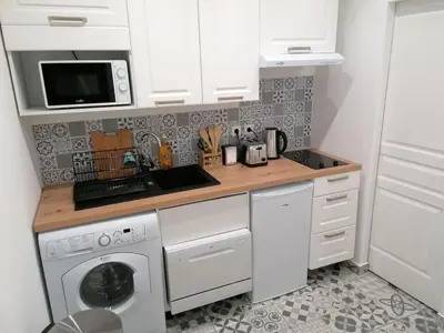 Cuisine ou kitchenette dans l'établissement Le Cosy & Boisé de Pontoise
