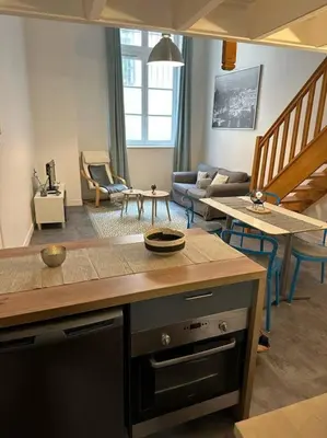 Coin salon dans l'établissement Appartement dans ancien Hôtel historique