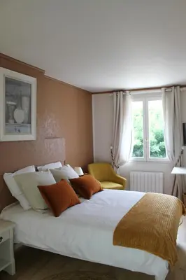 Un ou plusieurs lits dans un hébergement de l'établissement Chambres à la maison Hermitage
