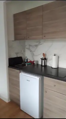 Cuisine ou kitchenette dans l'établissement Studio Résidence La Fôret Taverny