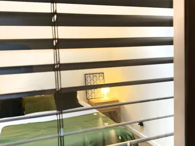 Un ou plusieurs lits dans un hébergement de l'établissement Appartement Paris by La Boîte En Plus