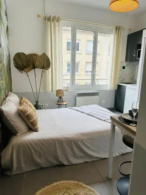 Un ou plusieurs lits dans un hébergement de l'établissement Studio Bohème hypercentre