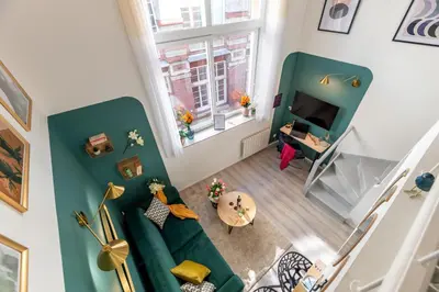 Coin salon dans l'établissement Calliopée by Kleidos - Magnifique duplex, Gros Horloge Rouen
