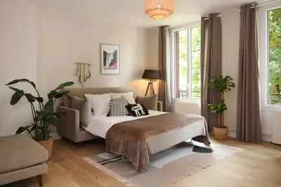Un ou plusieurs lits dans un hébergement de l'établissement Appartement Le Perchoir by La Boîte En Plus