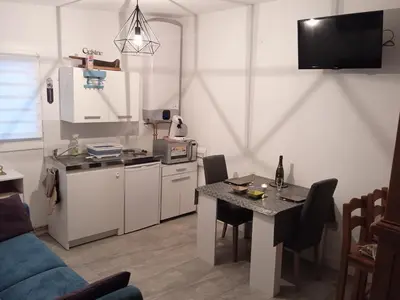Cuisine ou kitchenette dans l'établissement Capucine