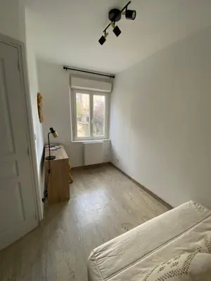 Un ou plusieurs lits dans un hébergement de l'établissement Cosy maison de ville Rouennaise