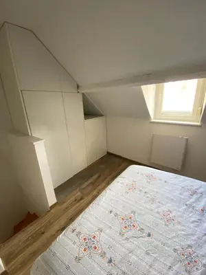Un ou plusieurs lits dans un hébergement de l'établissement Cosy maison de ville Rouennaise