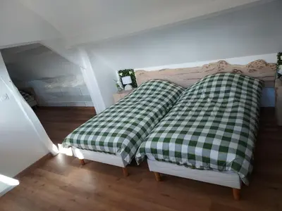 Un ou plusieurs lits dans un hébergement de l'établissement Le Refuge de Normandie avec Spa et Cheminée
