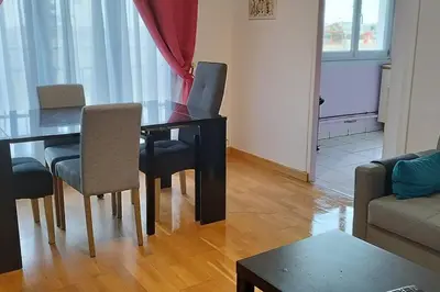 Coin salon dans l'établissement Poissy Appartement 2 chambres