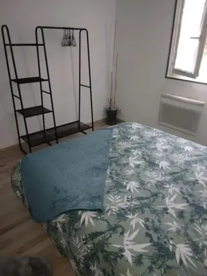 Un ou plusieurs lits dans un hébergement de l'établissement Appartement Cosy avec Terrasse