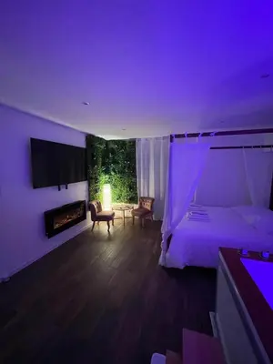 Un ou plusieurs lits dans un hébergement de l'établissement La Suite Bali Jacuzzi,Sauna,Netflix,Disney