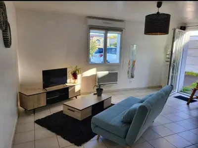 Coin salon dans l'établissement Appartement camon
