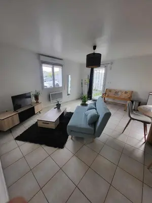 Coin salon dans l'établissement Appartement camon