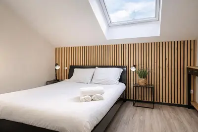 Un ou plusieurs lits dans un hébergement de l'établissement Appartement - 1 chambre - Proche Zénith & Centre