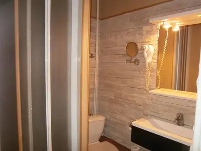 Salle de bains dans l'établissement Hotel Beausejour