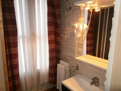Salle de bains dans l'établissement Hotel Beausejour