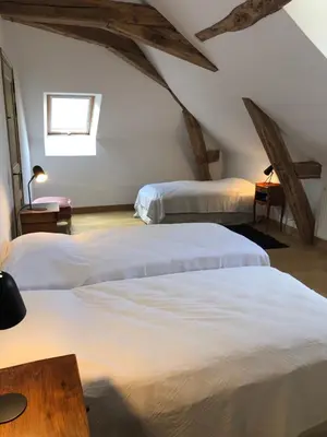 Un ou plusieurs lits dans un hébergement de l'établissement Chateau de Tosny