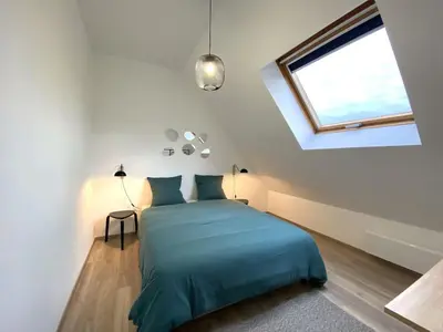 Un ou plusieurs lits dans un hébergement de l'établissement Le Loft boisé Giverny-Vernon - appt 8