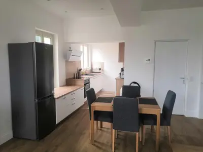 Cuisine ou kitchenette dans l'établissement Grand 2P vue seine
