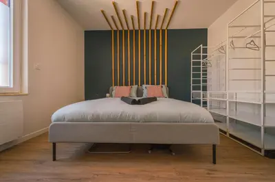Un ou plusieurs lits dans un hébergement de l'établissement La Villa Relax SPA Luxe