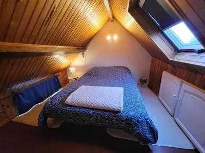 Un ou plusieurs lits dans un hébergement de l'établissement Charmant appartement au cœur du quartier St-Pierre