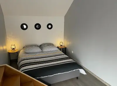 Un ou plusieurs lits dans un hébergement de l'établissement Appartement Amiens-Camon