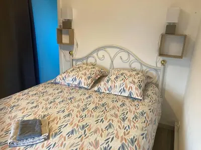 Un ou plusieurs lits dans un hébergement de l'établissement Studio « Bâbord » Le Tréport - vue mer & falaises