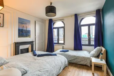 Un ou plusieurs lits dans un hébergement de l'établissement Grande amiénoise hyper-centre, 2 Parkings, Terrasse, Vue, BBQ, Hamac, Salle de Jeux