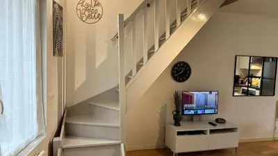 Télévision ou salle de divertissement dans l'établissement Ibiscus-Immoploc
