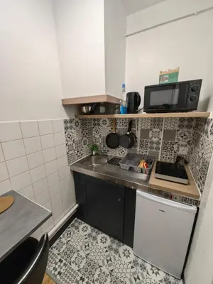 Cuisine ou kitchenette dans l'établissement Studio Chaleureux proche gare