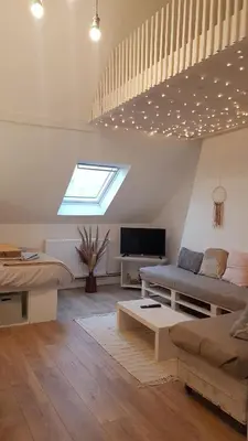 Télévision ou salle de divertissement dans l'établissement Le Sable d'Or - charme - détente