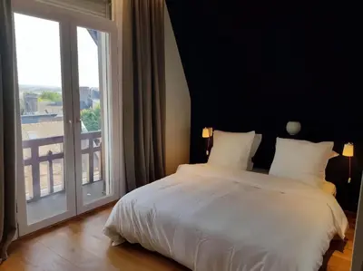 Un ou plusieurs lits dans un hébergement de l'établissement Appartement Design Rouen-gare avec parking privé