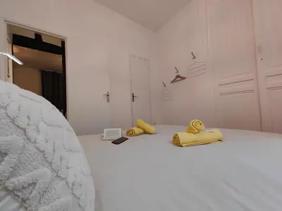 Un ou plusieurs lits dans un hébergement de l'établissement Appart'HomeCity - Rouen Marne Impressionniste