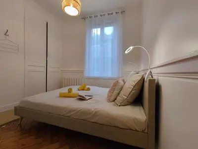 Un ou plusieurs lits dans un hébergement de l'établissement Appart'HomeCity - Rouen Marne Impressionniste