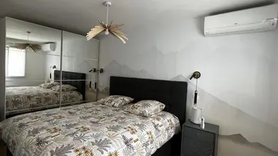 Un ou plusieurs lits dans un hébergement de l'établissement Sweet Home Maison entière