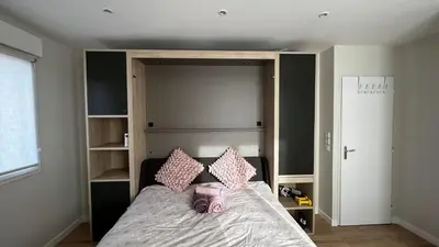 Un ou plusieurs lits dans un hébergement de l'établissement Sweet Home Maison entière