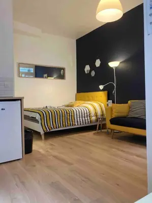 Un ou plusieurs lits dans un hébergement de l'établissement Studio N1 hypercentre Rue Saint Nicolas