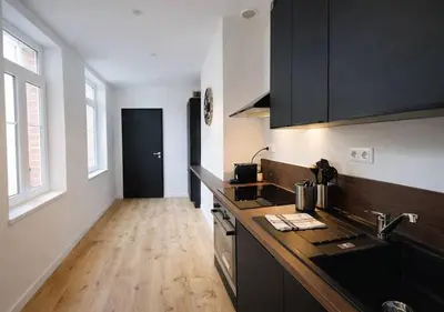 Cuisine ou kitchenette dans l'établissement L'Escapade des Privilégiés