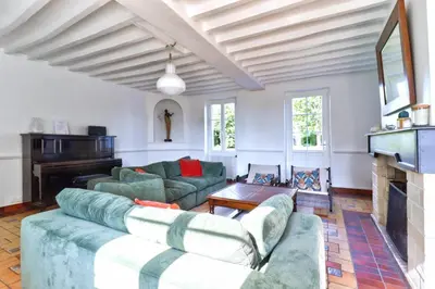 Coin salon dans l'établissement Grangebelle Maison 7 Chambres