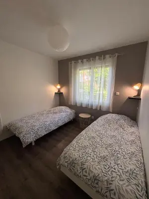 Un ou plusieurs lits dans un hébergement de l'établissement Gîte La Bienvenue